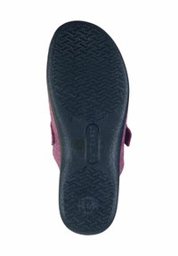 Shoe bottom featuring a black rubber sole with a textured zigzag pattern and a purple textile upper with a Velcro strap for secure fit.