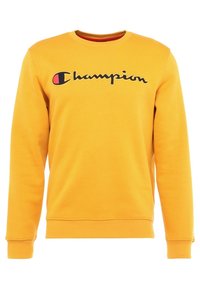 Felpa gialla in misto cotone, con collo rotondo, maniche lunghe e un grande logo "Champion" nero e rosso sul davanti.
