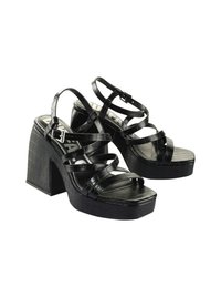 Black heeled sandals with a crocodile texture, wide block heel, multiple crossed straps, adjustable buckle, and a platform sole.