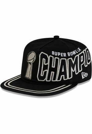 Black baseball cap with white stitching and text "Super Bowl LIX Champion" alongside a trophy graphic on the front panel and brim.