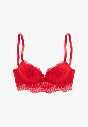 Red lace bra with molded cups, scalloped edges, and adjustable satin straps. Features a small decorative detail at the center front.