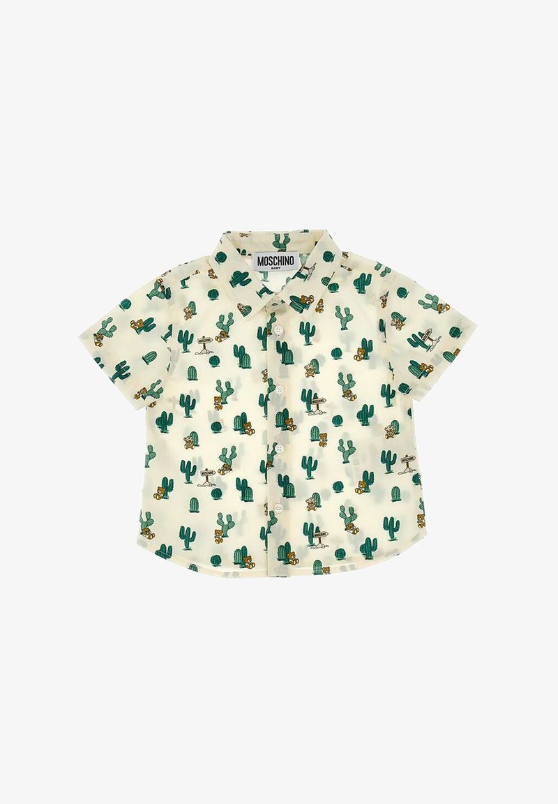 Camicia a maniche corte di colore crema con bottoni, caratterizzata da una stampa di cactus in verde e marrone con elementi da cartone animato. Realizzata in tessuto leggero e traspirante.