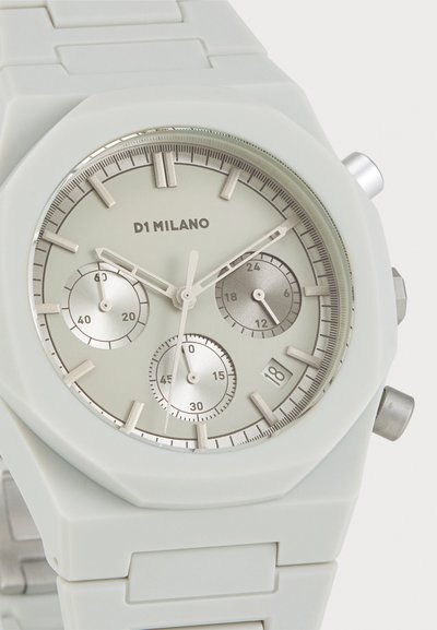 White silicone watch with a minimalist octagonal case, a light gray dial, silver sub-dials, and polished silver accents.