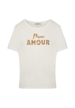 T-shirt court à manches courtes blanc avec l'inscription "Mon Amour" en lettres de sequins dorés. Tissu doux et lisse avec une coupe décontractée et un large col.