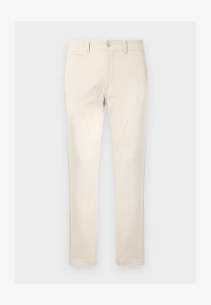 Beige Baumwollhosen mit geradem Schnitt, ausgestattet mit einer einzelnen Vorder- Tasche, Knopfverschluss und dezenten Nahtdetails.