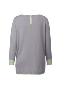 Långärmad topp i ljusgrått tyg med dragkedja i ryggen och kontrasterande mintgröna manschetter och fåll. Enkelt design med avslappnad passform.
