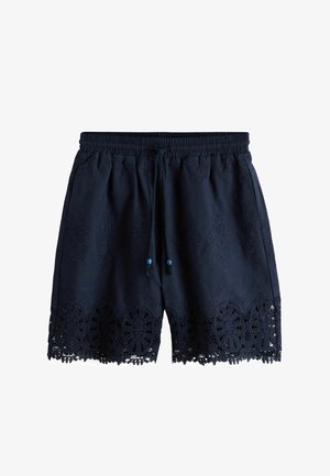 Pantaloni scurți bleumarin cu talie elastică, șnur și detalii sofisticate din dantelă de-a lungul tivului inferior.
