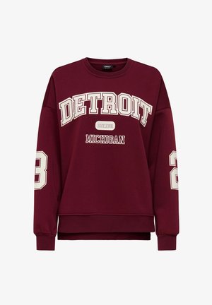 Bordo dukserica s bijelim natpisima "DETROIT" i "MICHIGAN". Ima dugačke rukave, rebraste manžete i opušteni kroj s zaobljenim rubom.