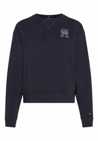 Sudadera de la armada hecha de algodón, con puños y dobladillo de canalé. Incluye un pequeño logo bordado en el pecho y un diseño de cuello en V.