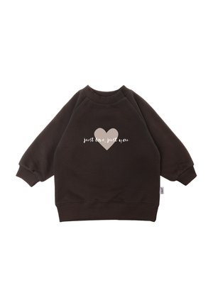 Dark brown long-sleeve sweatshirt with ribbed cuffs and hem, featuring a beige heart and white text "just love, just you" on the front.