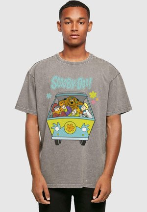Gray oversized t-shirt featuring a graphic of a colorful van with characters from Scooby-Doo, detailed with flowers and cartoon elements.