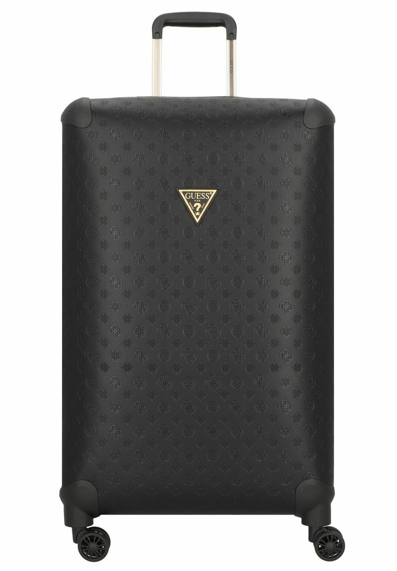 Valise rigide noire en matériau texturé, arborant un logo triangulaire doré. Équipée d'une poignée télescopique et de quatre roues.
