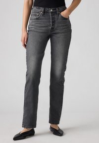 Grijze denim jeans met hoge taille en een rechte pasvorm, voorzien van subtiele vervaging, oranje stiksels en voortassen.