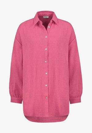 Roze overhemdsblouse van gestructureerde, lichte stof. Heeft een kraag, lange mouwen met elastische manchetten en een afgeronde zoom.