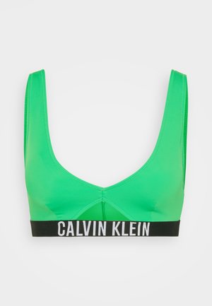 Jasne zelené braletky vyrobené z hladkého materiálu, s širokým čiernym pásom s bielym logom "CALVIN KLEIN", okrúhlym výstrihom a hrubými ramienkami.