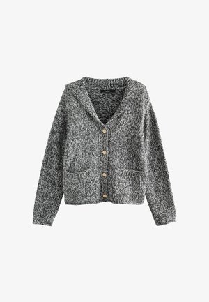 Hallikas ja must kootud kardigan, millel on šalli kaelus, viis kuldset nupu ja kaks esist kotti. Tekstuuriga kangas, mis näeb välja mugav.