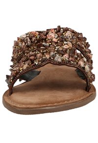 Brown leather slide sandal featuring a decorative upper with various brown stones, beads, and gold accents. Soft inner lining and flat sole.