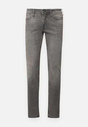 Falmede grå jeans med slim fit, fem lommer og kontraststing. Har glidelås og beltesløyfer. Minimalistisk design.