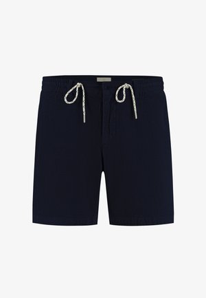 Short bleu marine texturé avec taille élastique, cordons blancs, bouton et fermeture éclair, conçu pour un usage décontracté.