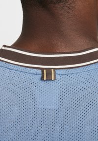 Nike Performance HERITAGE - Triko s potiskem - aegean storm