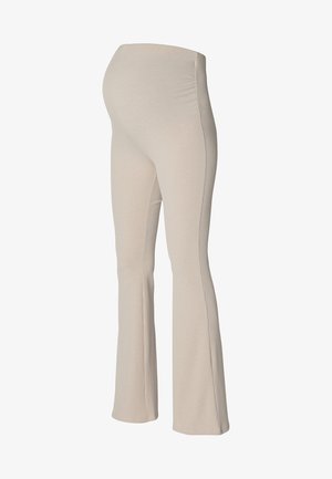 Leggings de maternité beige côtelés avec une taille ajustée et des jambes évasées, comportant des coutures verticales et une texture lisse sur l'ensemble.