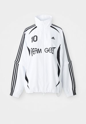 Bela jakna s črnimi detajli, z visokim ovratnikom, zadrgo spredaj, logotipom Adidas, velikim odtisom "10" in besedilom "TEAM GEIST".