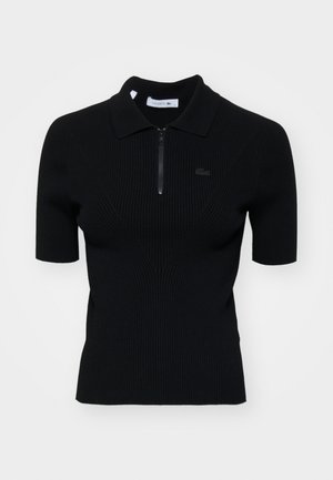 Polo shirt nero a coste con maniche corte, colletto con zip e un sottile dettaglio del logo. Realizzato in materiale a maglia testurizzato.
