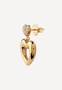Gold-tone heart-shaped earrings featuring a larger hollow heart and a smaller heart adorned with clear crystals. Marked with "Guess."