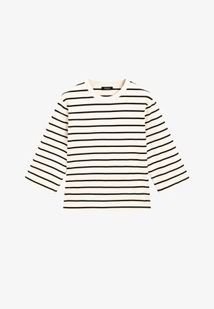 Krémová pruhovaná dlouhá košile s černými vodorovnými pruhy, kulatým výstřihem a měkkým bavlněným materiálem. Obsahuje rukávy po tři čtvrtiny.