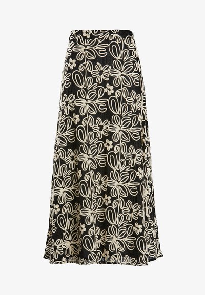 Jupe noire avec broderie florale blanche, dotée d'un design évasé et d'un tissu texturé, mi-longue avec une ceinture en haut.