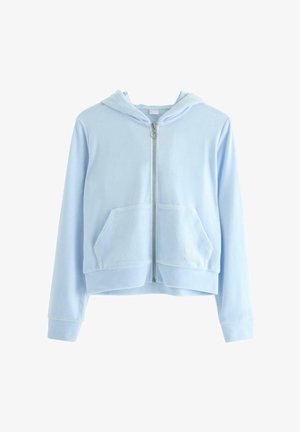 Felpa con zip di colore azzurro chiaro, realizzata in tessuto morbido, con tasca a marsupio e dettagli ricamati. Design cropped con cappuccio.