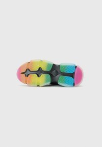 Sport shoe outsole featuring a segmented design with gradient colors: pink, yellow, green, and blue, textured for grip and flexibility.