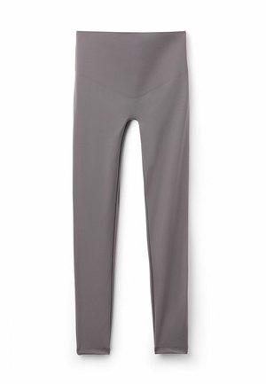 Grå leggings til kvinder med høj talje, en glat finish og V-formet sømdetalje ved taljen, lagt fladt på en hvid baggrund.