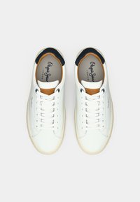 Pair of white low-top sneakers with white laces, tan and navy accents, and "Pepe Jeans London" branding inside and on the side.