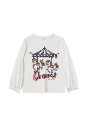Camisa de manga larga blanca con un diseño de carrusel que presenta tres caballos; "Sueños" en texto de purpurina rosa; puños elásticos. Material de algodón suave.