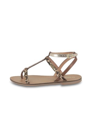 Brown and metallic sandals with a leopard print band, flat sole, and ankle strap featuring a small buckle detail.