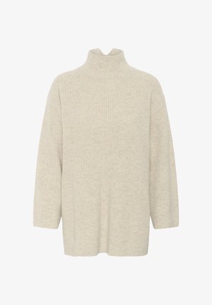 Kerge beežist turtleneck-sveter, millel on vafli tekstuur, lahtine lõige ja kolmandiku pikkusega varrukad, valmistatud pehmest kootud kangast.