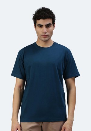 T-shirt in cotone blu navy, con maniche corte e scollatura rotonda, caratterizzato da un colore uniforme senza motivi né decorazioni.