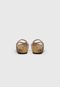 Purple sandals with multiple straps, cork footbed, and a black rubber sole. Features a subtle gold accent on the strap.