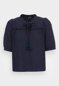 Blusa blu navy in tessuto leggero, con maniche corte a sbuffo, scollatura a chiave con fiocco e nappe decorative.