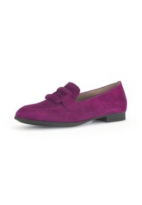 Purple suede loafers with a flat black sole, featuring a decorative bow on the front and rounded toe design. Smooth texture throughout.