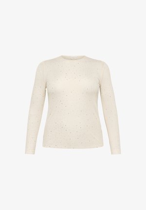 T-shirt à manches longues couleur crème avec un motif à pois subtil et des accents argentés ; texture lisse, col rond, design ajusté.