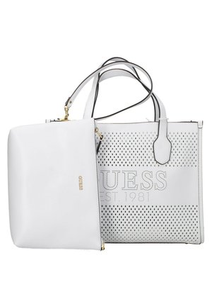 White Guess tote bag with perforated diamond pattern and smaller matching pouch attached with gold hardware.