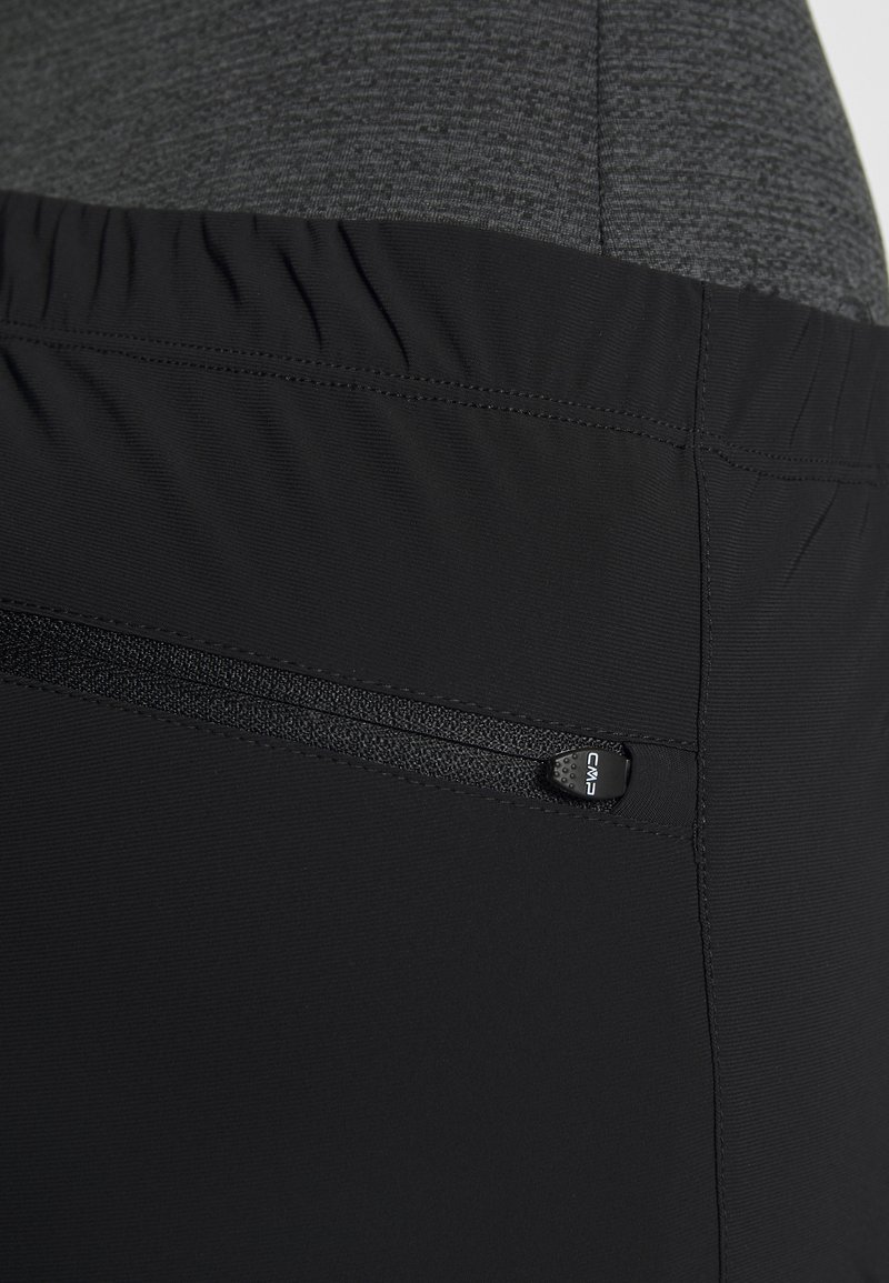 Schwarze Sportleggings mit einem strukturierten grauen Bund, elastischem oberen Teil und einer kleinen Reißverschlusstasche an der Seite mit einem Zugband.