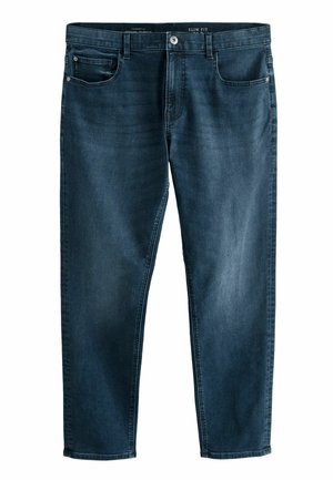 Slim fit mørkeblå jeans lavet af denim, med fem lommer, let falmning og dekorativ syning langs sømmene.