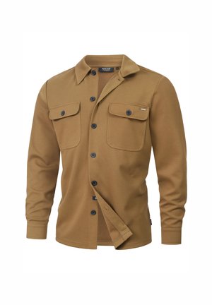 Ruskea pitkähihaisen paidan, joka on valmistettu teksturoidusta kankaasta, jossa on terävä kaulus, kaksi etutaskua ja mustat napit etuosassa.