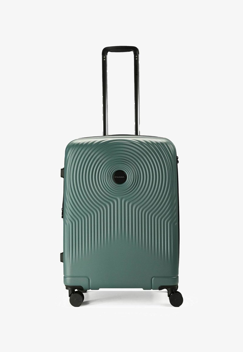 Hartschalentrolley in Türkis mit konzentrischen Wellenmustern, schwarzem Reißverschluss und Doppelrollen. Ausziehbarer schwarzer Griff für eine einfache Handhabung.