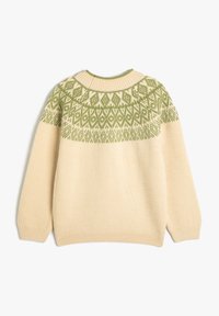 Beige stickad tröja med rund halsringning och ett grönt geometriskt mönster över bröstet. Långa ärmar och en avslappnad passform.