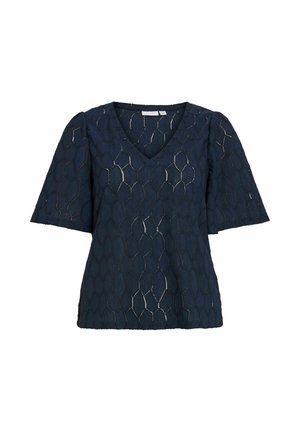 Blouse bleu marine à manches courtes avec col en V et motif géométrique nid d'abeille texturé sur tissu léger.