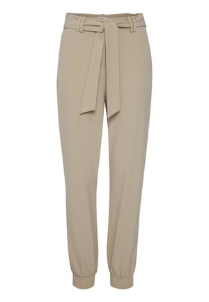 Beige tapered Hosen mit einem gebundenen Gürtel, elastischen Bündchen und glatter Textur. Sie verfügen über zwei seitliche Taschen und einen dezenten Glanz.